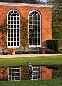 THE NATIONAL TRUST - DUNHAM MASSEY, CHESHIRE: THE ORANGERY REFLECTED IN POOL - MORNING LIGHT
