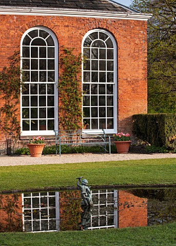 THE_NATIONAL_TRUST__DUNHAM_MASSEY_CHESHIRE_THE_ORANGERY_REFLECTED_IN_POOL__MORNING_LIGHT