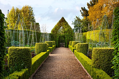 EAST_RUSTON_OLD_VICARAGE_GARDEN_NORFOLK_THE_LONG_BORDERS_WITH_GRAVEL_PATH_CLIPPED_TOPIARY_BOX_HEDGIN