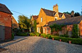 THE OLD VICARAGE, WORMLEIGHTON, WARWICKSHIRE: THE OLD VICARAGE WITH GRAVEL DRIVE AT SUNSET