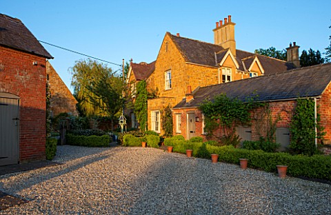 THE_OLD_VICARAGE_WORMLEIGHTON_WARWICKSHIRE_THE_OLD_VICARAGE_WITH_GRAVEL_DRIVE_AT_SUNSET