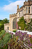 HADDON HALL, DERBYSHIRE: PLANTED WALL BELOW THE HALL IN JUNE
