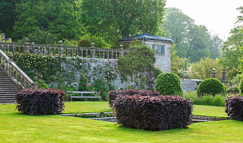 HADDON_HALL_DERBYSHIRE_THE_LOWER_GARDEN_WITH_VIEWS_OF_THEUPPER_GARDEN_TERRACES__JUNE__MORNING_LIGHT