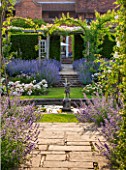 GREAT FOSTERS, SURREY: THE ROSE GARDEN IN JUNE: FOUNTAIN, CATMINT - NEPETA FAASSENII, ARBOUR, POOL, POND, STATUE, FORMAL, SUMMER, ENGLISH GARDEN, ROSES, CLASSIC, ROMANTIC