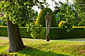 GREAT FOSTERS. SURREY:  SOARING FIGURE - SCULPTURE IN STAINLESS STEEL BY RICK KIRBY BESIDE THE MOAT - WATER, ART, CLASSIC, FORMAL, COUNTRY GARDEN