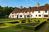 LITTLE MYNTHURST FARM, SURREY: THE HOUSE WITH FORMAL KNOT GARDEN. TOPIARY, CLIPPED, BOX, EDBGED, BEDS, GRASS, LAWN