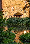 OLD NETLEY MILL, SHERE, SURREY: NETLEY OLD MILL SEEN FROM ACROSS THE LAKE - EARLY MORNING LIGHT.  SUMMER, JUNE