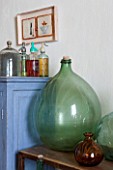 CIUTADELLA MENORCA, SPAIN: EVELYNE MANDEL HOUSE - FRONT ROOM, LIVING ROOM IN BLUE AND YELLOW  - VINTAGE MENORCAN GLASS JARS AND GLASS SODA SYPHONS