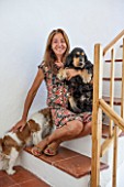 CIUTADELLA MENORCA, SPAIN: EVELYNE MANDEL HOUSE - EVELYNE WITH HER TWO DOGS ON STAIRS