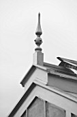 WEST DEAN GARDENS, WEST SUSSEX: BLACK AND WHITE IMAGE OF GREENHOUSE ROOF AND FINIAL IN THE WALLED KITCHEN GARDEN. AUGUST