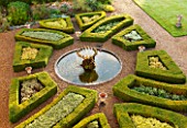 LAMPORT HALL, NORTHAMPTONSHIRE: AERIAL VIEW LOOKING DOWN ONTO THE ITALIAN GARDEN WITH BOX PARTERRES, GRAVEL PATHS AND FOUNTAIN. FORMAL, HISTORIC, CLASSIC ENGLISH GARDEN