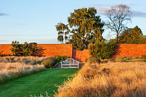 LAMPORT_HALL_NORTHAMPTONSHIRE_WALLED_CUTTING_GARDEN_WITH_BLUE_BENCH__SEAT_AND_WALLS__KITCHEN_GARDEN_