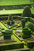 GREAT FOSTERS. SURREY: VIEW OVER FORMAL TOPIARY GARDEN IN AUGUST - CLIPPED, SHAPED, EVERGREEN, SHRUBS, HEDGES, HEDGING, CLASSIC COUNTRY GARDEN
