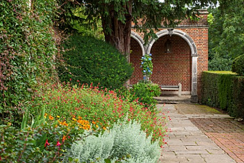 GREAT_FOSTERS_SURREY_VIEW_ALONG_PATH_TO_SUMMERHOUSE_WITH_BORDERS_OF_HELENIUMS_AND_SALVIAS_CLASSIC_CO