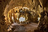 PAINSHILL PARK, SURREY: THE CRYSTAL GROTTO WITH WINDOW TO LAKE BEYOND - CLASSIC, OOLITIC LIMESTONE, STALACTITES, MYSTERY, LANDSCAPE GARDEN, ORNAMENT