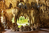 PAINSHILL PARK, SURREY: THE CRYSTAL GROTTO WITH WINDOW TO LAKE BEYOND - CLASSIC, OOLITIC LIMESTONE, STALACTITES, MYSTERY, LANDSCAPE GARDEN, ORNAMENT