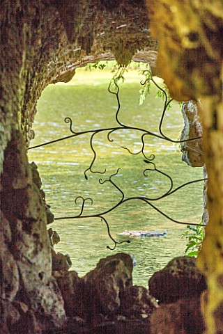 PAINSHILL_PARK_SURREY_THE_CRYSTAL_GROTTO__VIEW_THROUGH_WINDOW_OPENING_TO_LAKE_AND_REFLECTIONS__CLASS