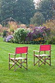 ELLICAR GARDENS, YORKSHIRE - DESIGNER SARAH MURCH - LAWN AND BORDER WITH RED CHAIRS - A PLACE TO SIT, RELAX, RELAXING, COUNTRY GARDEN
