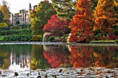 THE NATIONAL TRUST - SHEFFIELD PARK, SUSSEX,  IN AUTUMN. OCTOBER, FALL, VIEW ACROSS THE LAKE TO THE HOUSE