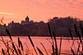 CASTLE HOWARD, YORKSHIRE: CHRISTMAS - SUNRISE OVER THE GREAT LAKE WITH THE HOUSE IN THE BACKGROUND - WINTER, ORANGE, SKY, WATER, POND