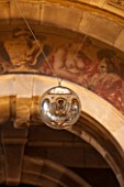 CASTLE HOWARD, YORKSHIRE: CHRISTMAS - THE GREAT HALL DECORATED FOR CHRISTMAS - LARGE BAUBLE HANGING FROM CEILING - BAUBLES - DECORATIVE, ORNAMENT, FESTIVE, WINTER, NOVEMBER