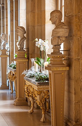 CASTLE_HOWARD_YORKSHIRE_CHRISTMAS__THE_ANTIQUE_PASSAGE_DECORATED_AT_CHRISTMAS_WITH_WHITE_ORCHIDS_CAN