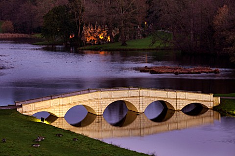 PAINSHILL_PARK_SURREY_THE_FIVE_ARCH_BRIDGE_AND_CRYSTAL_GROTTO_LIT_UP_AT_NIGHT__LIGHTING_FOLLY_FOLLIE