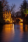 PAINSHILL PARK, SURREY: THE CRYSTAL GROTTO  LIT UP AT NIGHT - LIGHTING, FOLLY, FOLLIES, HISTORIC, LAKE, WATER, LANDSCAPE, WINTER, DECEMBER, CHRISTMAS, REFLECTION, REFLECTIONS
