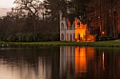 PAINSHILL PARK, SURREY: THE RUINED ABBEY SEEN ACROSS THE LAKE, LIT UP AT NIGHT - LIGHTING, HISTORIC, LAKE, WATER, LANDSCAPE, WINTER, DECEMBER, CHRISTMAS, REFLECTION, REFLECTIONS