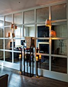 SALLY STOREY HOUSE, LONDON: OPEN PLAN SITTING ROOM / HALL WITH MIRRORED WALL, MIRROR, LIGHTS, CANDLES, CANDLE, SCULPTURE
