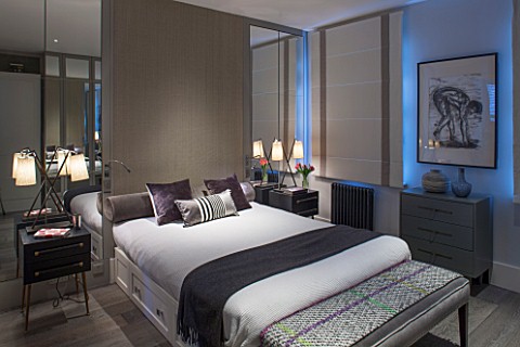 SALLY_STOREY_HOUSE_LONDON_MASTER_BEDROOM_WITH_BED_CUSHIONS_AND_SIDEBOARDS_WITH_LIGHTS__LIGHTING_LIGH