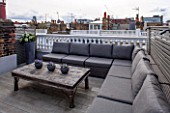 SALLY STOREY HOUSE, LONDON: ROOF TERRACE WITH FAKE WOODEN DECKING, LOUNGERS AND WOODEN TABLE. FAKE HYDRANGEAS, ROOF GARDEN, SEAT, SEATS, ENTERTAINING, DECK, TOWN GARDEN, MODERN