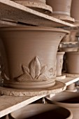 WHICHFORD POTTERY, WARWICKSHIRE: JUST MADE TERRACOTTA HOSTA CONTAINERS DRYING OUT ON WOODEN RACKS  - DECORATION,  DECORATIVE, ORNAMENT, GARDEN