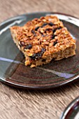 WHICHFORD POTTERY, WARWICKSHIRE: HOME MADE FRUIT FLAPJACK SERVED ON WHICHFORD POTTERY PLATE IN THE CAFE