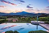 LA JEG, PROVENCE, FRANCE: DESIGNER ANTHONY PAUL - SWIMMING POOL, DAWN, MONT VENTOUX BEHIND. SCULPTURE MAN AND BIRD BY MARZIA COLONNA , MAY, MEDITERRANEAN, WATER, ORNAMENT