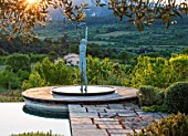 LA JEG, PROVENCE, FRANCE: DESIGNER ANTHONY PAUL - SWIMMING POOL, DAWN, MONT VENTOUX BEHIND. SCULPTURE MAN AND BIRD BY MARZIA COLONNA , MAY, MEDITERRANEAN, WATER, ORNAMENT