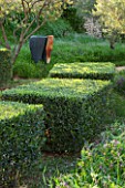 LA JEG, PROVENCE, FRANCE: DESIGNER ANTHONY PAUL - CLIPPED OLIVE TOPIARY, BURNT WOOD SCULPTURE MY HOUSE HAS MANY CHAMBERS BY WALTER BAILEY