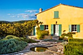LA JEG, PROVENCE, FRANCE: DESIGNER ANTHONY PAUL - HOUSE AND FORMAL GARDEN WITH ROSA BANKSIAE LUTEA - BANKSIAN ROSE, ROSES, CLIMBER, RAMBLER, POOL, RILL, SPRING, MAY