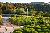 LA JEG, PROVENCE, FRANCE: DESIGNER ANTHONY PAUL - CLIPPED LAVENDER BESIDE STONE PATH, SPRING. MEDITERRANEAN, GARDEN, GREEN, PROVENCE, PROVENCAL, MAY, SCULPTURE
