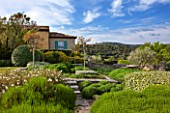 LA JEG, PROVENCE, FRANCE: DESIGN: ANTHONY PAUL - THE HOUSE WITH BLUE SHUTTERS. CLIPPED SHRUBS AND CISTUS. MEDITERRANEAN, ART, SUMMER,  COUNTRY, GARDEN