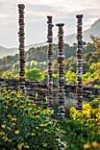 LA JEG, PROVENCE, FRANCE: DESIGN: ANTHONY PAUL - PATH, PHLOMIS, SCULPTURE - SILENT COLUMNS BY CHRIS BOOTH, WALL, STONE, SUMMER,  COUNTRY, GARDEN