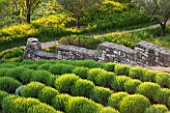 LA JEG, PROVENCE, FRANCE: DESIGNER ANTHONY PAUL - ROWS OF CLIPPED LAVENDER IN SPRING. STONE WALL, MEDITERRANEAN, GARDEN, GREEN, PROVENCE, MAY, PATTERN