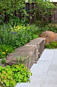 CHELSEA FLOWER SHOW 2016: - M & G GARDEN DESIGNED BY CLEEVE WEST - PATIO AND STONE SEAT / BENCH - OAK BOUNDARY FENCE - ROCK, ROCKS, SHADE