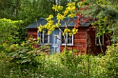 BRYANS GROUND, HEREFORDSHIRE: SUMMERHOUSE / SHED / GARDEN BUILDING IN CRICKET WOOD - WOODS, WOODLAND, SHADE, MAY, SPRING