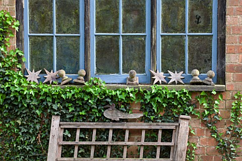 BRYANS_GROUND_HEREFORDSHIRE_BLUE_WOODEN_WINDOW_WITH_ORNAMENTS__GARDEN_ORNAMENT_FENCETOPS_DECORATION_