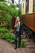 HOPE SHARP STORY, CHELSEA FLOWER SHOW 2016: HOPE SHARP BESIDE A FERN IN THE BOWDENS STAND - BESIDE IS ZENA - SISTER TRAIN TO THE ORIENT EXPRESS