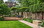 PRIVATE GARDEN LONDON DESIGNED BY LUCY WILLCOX AND ANA SANCHEZ MARTIN: TOWN GARDEN WITH LAWN, PATHS, WALL, PERGOLA, BORDERS, SEAT - JUNE, SUMMER, FORMAL, TABLE, CHAIRS