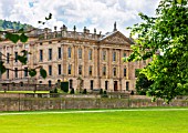 CHATSWORTH HOUSE, DERBYSHIRE: FLORABUNDANCE - VISTA OF CHATSWORTH HOUSE SEEN FROM THE DIVERTED CARRIAGEWAY BY CAPABILITY BROWN. NOTE THE GOLD-RIMMED WINDOWS.HISTORIC,GRAND.