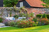 THE COACH HOUSE, SURREY:WALLED GARDEN & SUMMER BORDER WITH SALVIA ROYAL BUMBLE & MIXED HERBACEOUS PERENNIALS INCL.FOENICUM VULGARE GIANT BRONZE. CLIMBING PINK ROSE ON WALL.