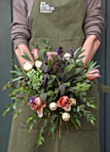 THE REAL FLOWER COMPANY:GIRL/WOMAN HOLDING BEAUTIFUL FLORAL POSY/ARRANGEMENT WITH ROSA CAFFE LATTE AND PAVLOVA. ALSO WITH PURPLE AND SILVER LAVENDER,MIXED SAGE AND SENECCIO
